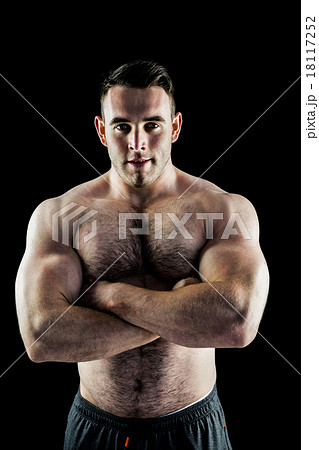 男性 筋肉 腕組みの写真素材