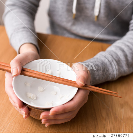 ご飯粒 食べ残し 食べ物 箸の写真素材