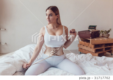 Sexy blonde woman in a white T-shirt and panties - Stock Photo [31717654] -  PIXTA