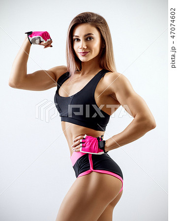 力こぶ 女性の写真素材