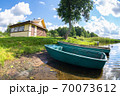 Plastic fishing boat with motor on the lake in summer day. Nature