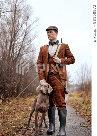 Confident caucasian hunter. American hunting rifles. Hunting