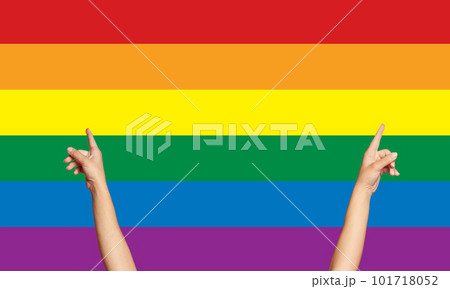 Hand holding rainbow heart on lgbt flag colours, pride month
